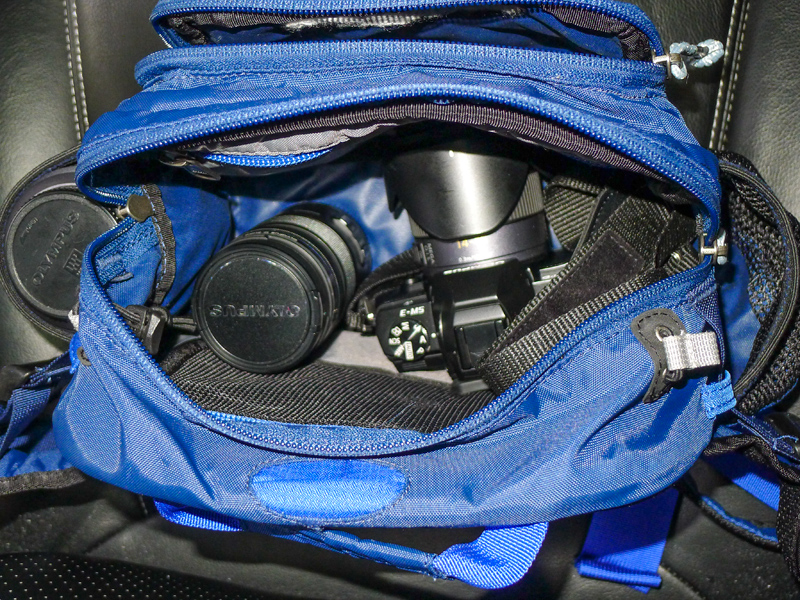 Inside the bag is the OMD with 14-45 lens attached, the 12-50 Olympus lens and in the size pocket the bulky (in comparison) Panasonic 45-200.