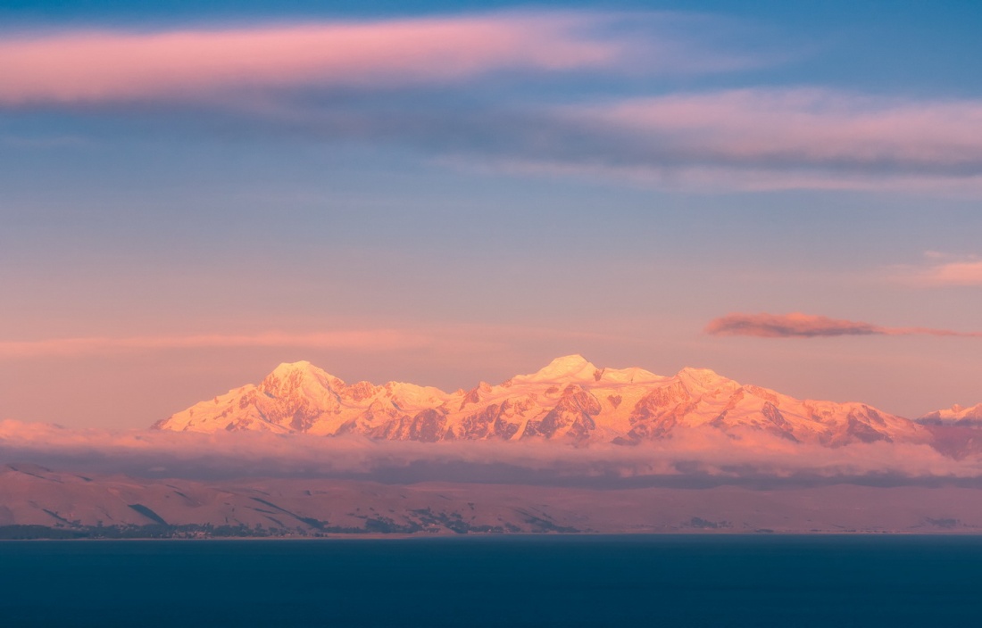 The Andes at sunset from Isle de Sol on Lake Titicaca, Bolivia.